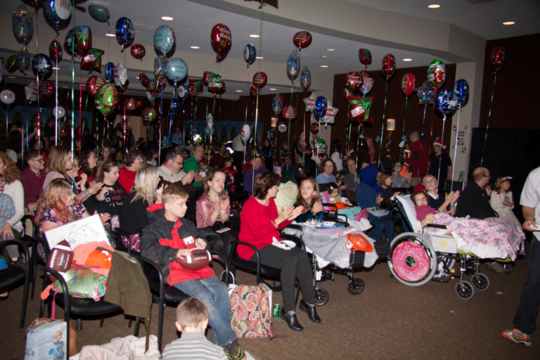 Families, volunteers and staff gather to celebrate at the International Center for Limb Lengthening pediatric holiday party