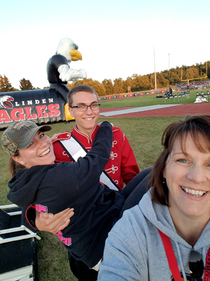 Chase having fun on the field with marching band