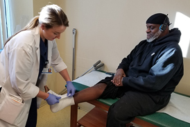 Andre having his ankle wrapped at the International Center for Limb Lengthening