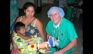 Dr. John Herzenberg with a patient he treated during an international medical mission