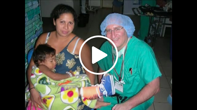 Dr. John Herzenberg with a patient he treated during an international medical mission