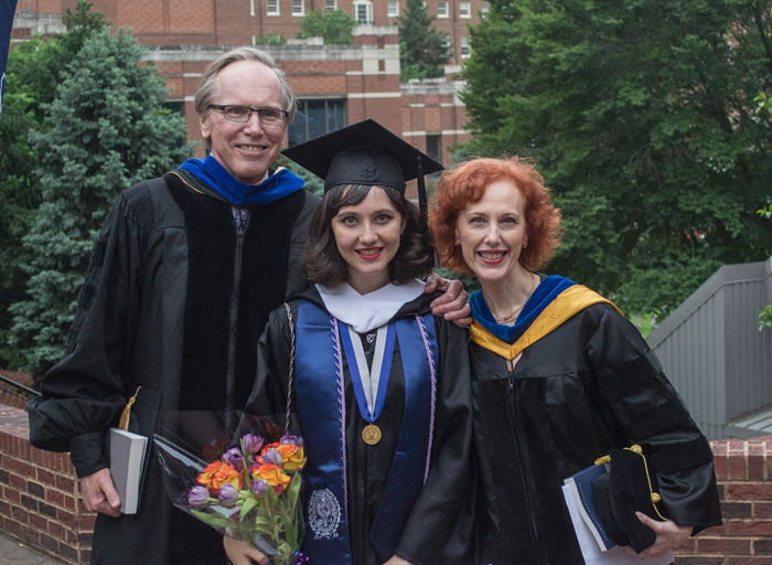 Katia with her parents at her college graduation