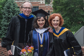 Katia with her parents at her college graduation