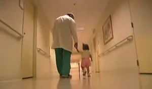 Dr. John Herzenberg walking with a clubfoot patient in the International Center for Limb Lengthening clinic