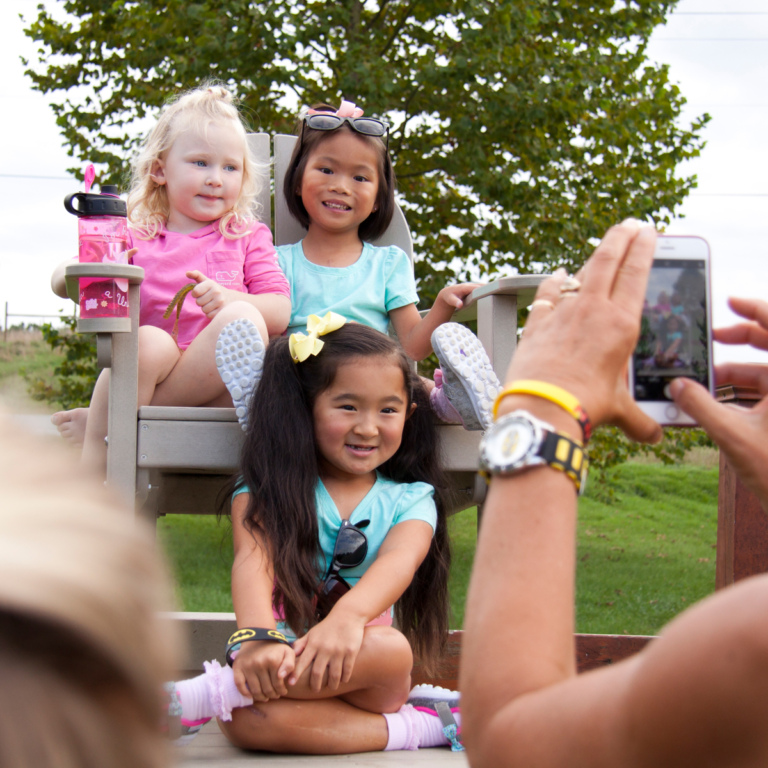 3 young girls having their picture taken outside during Rubin Institute for Advanced Orthopedics 2018 Save-A-Limb Pool Party event