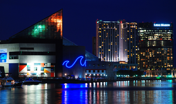 Baltimore's Inner Harbor at night, including the National Aquarium and the Legg Mason Tower