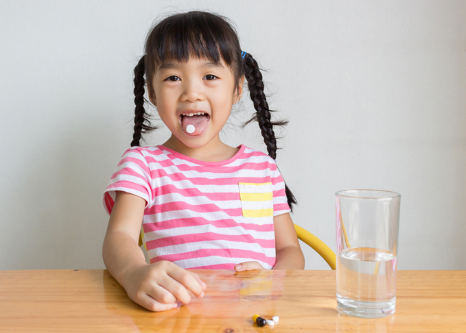 Child taking medication