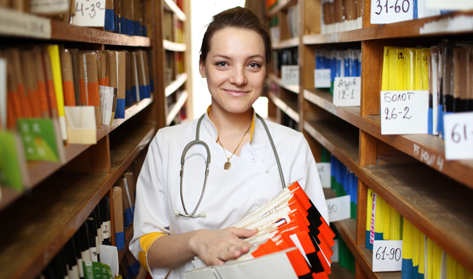 Female doctor holding medical records