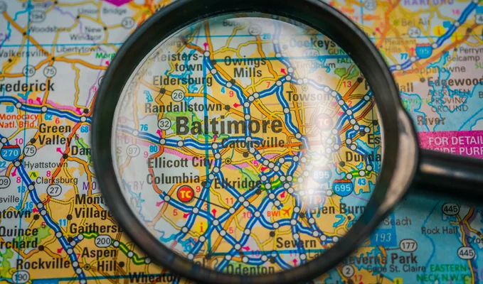 Magnifying glass on a map of Baltimore, Maryland