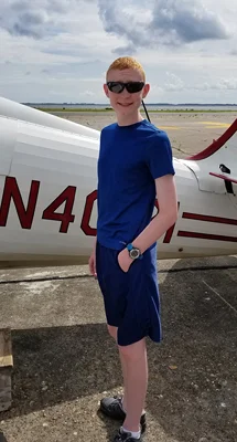 Gary standing next to a biplane