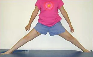 Patient demonstrating the hip abduction exercise for Perthes