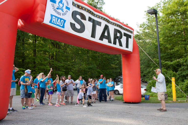 Dr. Shawn Standard addressing Camp Save-A-Limb participants at the Lenny B. Robinson Make A Difference Walk start gate