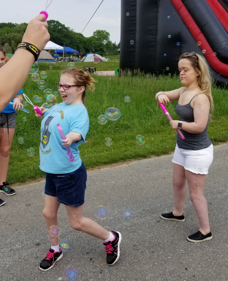 2 patients making bubbles with bubble wands