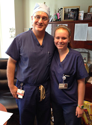 Carly with Dr. Standard while volunteering