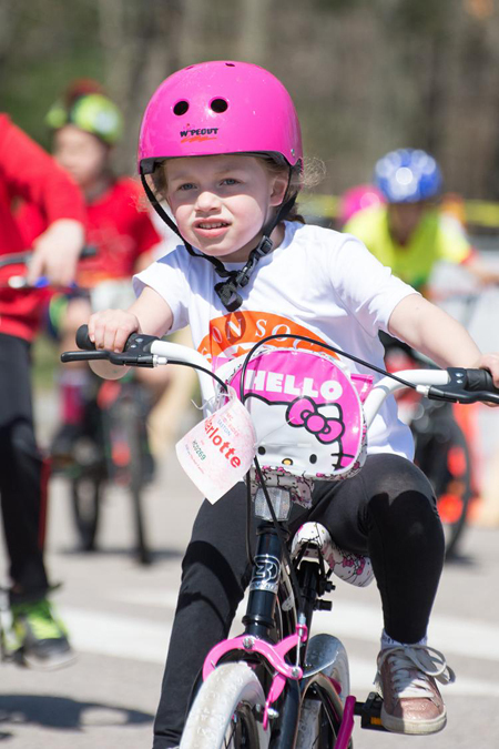 Charlotte riding in an hour bike ride for children