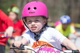 Charlotte riding in an hour bike ride for children