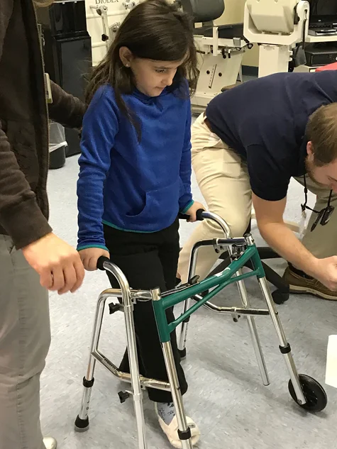 Gracie learning to use a walker