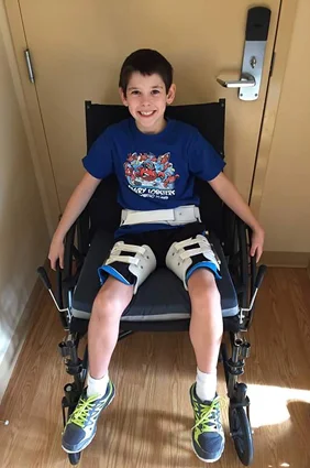 Jackson in a wheelchair during treatment