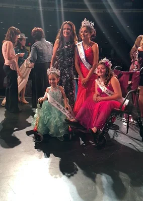 Alena winning the Miss You Can Do It pageant
