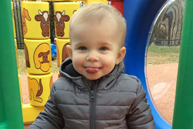 Cannon playing at a playground after treatment