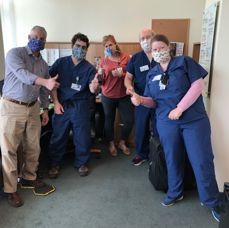 The Pediatric Orthopedics team at the International Center for Limb Lengthening wearing masks and giving thumbs up