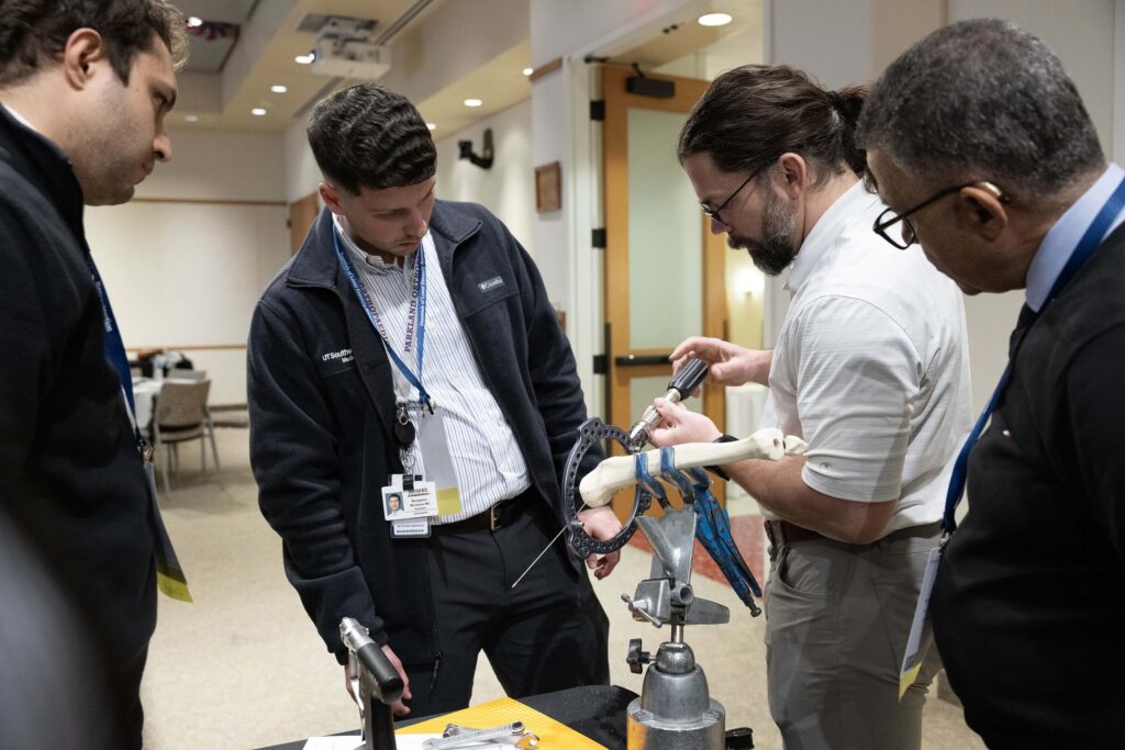 Dr. Philip McClure instructing ELER participants in the hands-on sawbone lab