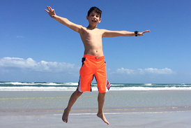 Jackson jumping up high on the beach