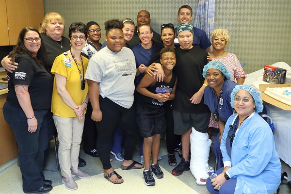 Kahlil in a leg cast with his family, Dr. Conway and some of his Sinai Hospital treatment team