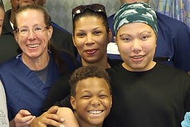 Kahlil in a leg cast with his family, Dr. Conway and some of his Sinai Hospital treatment team