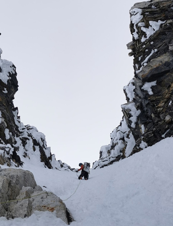 Keagan climbing a big mountain in the snow