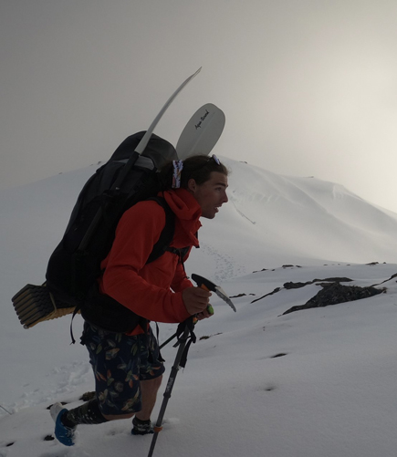 Keagan hiking on top of a snowy mountain