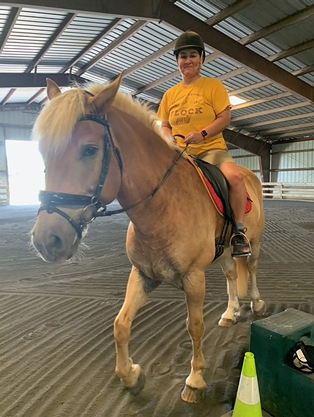 Lili riding a horse