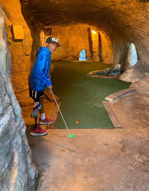Sudan playing mini-golf