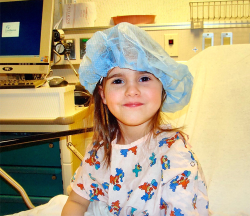 Cassidy as a very young girl in a hospital bed