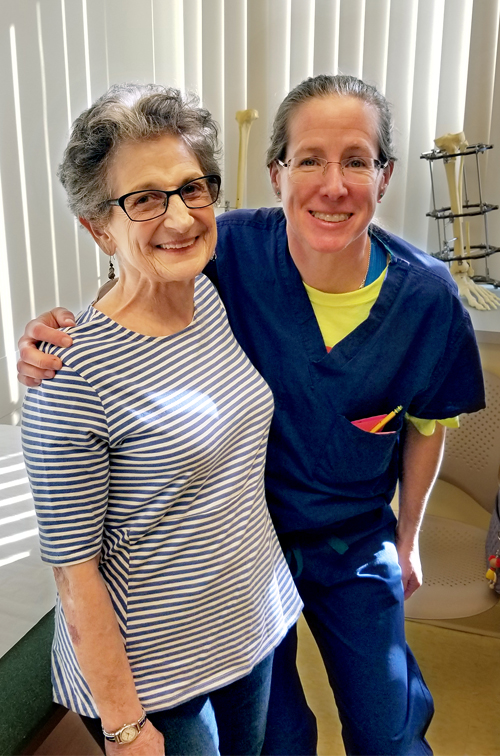 Elaine and Dr. Janet Conway smiling at a clinic follow-up appointment