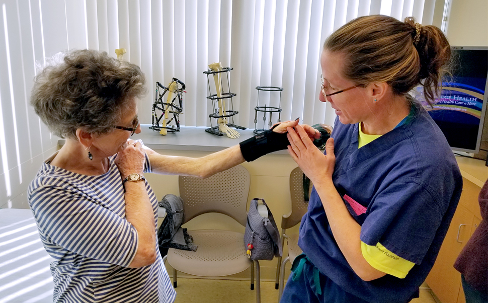 Dr. Janet Conway examining Elaine's arm