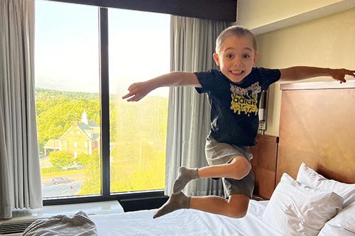 Jackson jumping on a bed