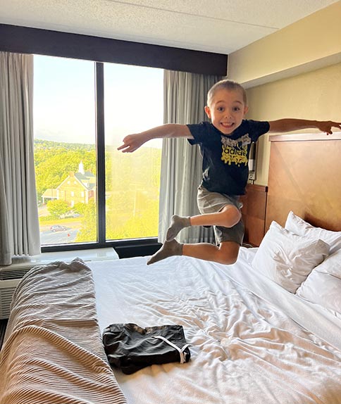 Jackson jumping on a bed