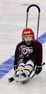 Jackson playing sled hockey