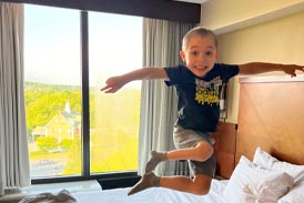 Jackson jumping on a bed