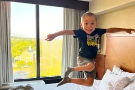 Jackson jumping on a bed