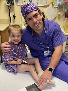  Jackson with Dr. McClure before a surgery