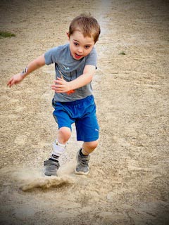 Jackson as a young boy running to home plate