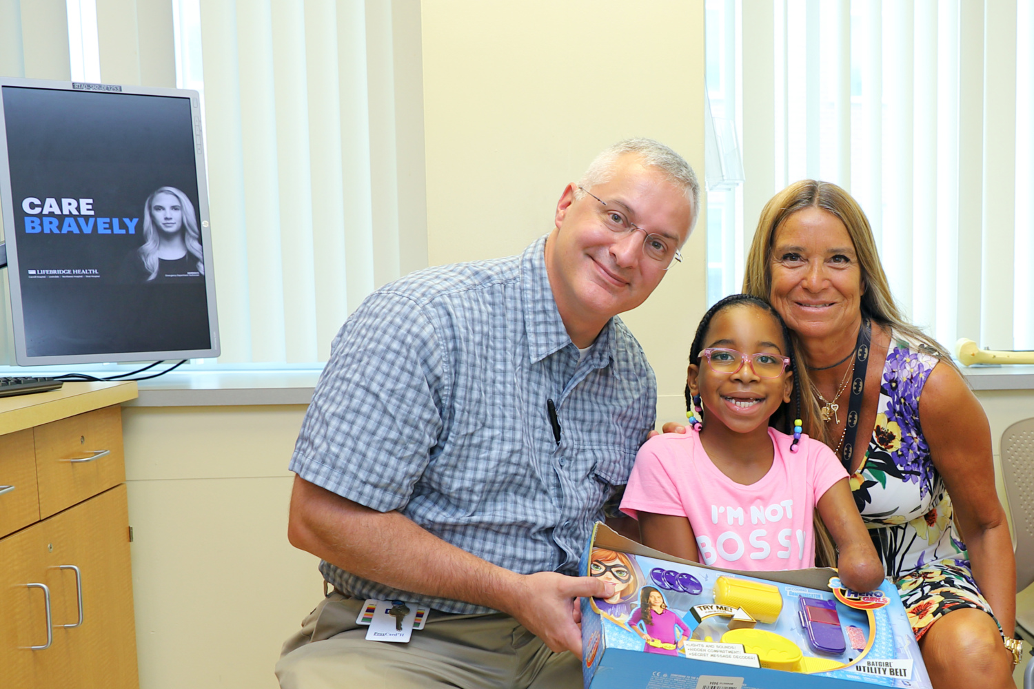 Kennedee with Dr. Shawn Standard and Pediatric Liaison Marilyn Richardson