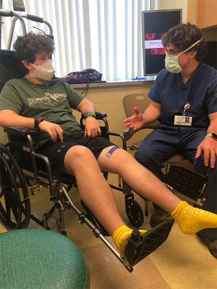 Dr. McClure talking with Zackary during his follow-up visit