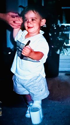 Ken as a toddler with a sizable shoe lift on his left leg